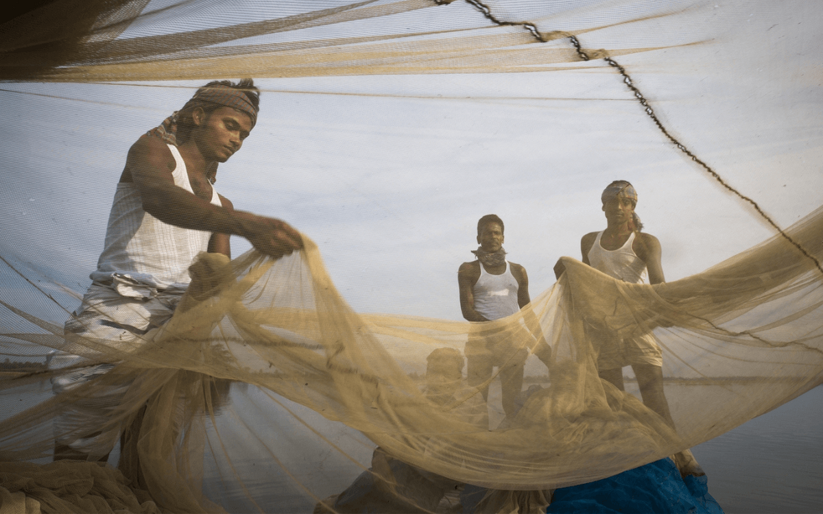 Drei Fischer bei der Arbeit in Bangladesch. © GIZ / Ranak Martin
