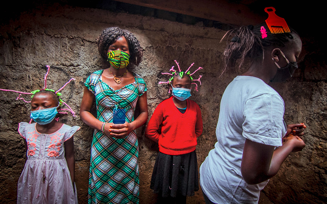 Young Girls from Slums in Kenia use their Corona Virus braided hair style in spreading awares to the society. Photo: Donwilson Odhiambo/ZUMA Wire/picture alliance
