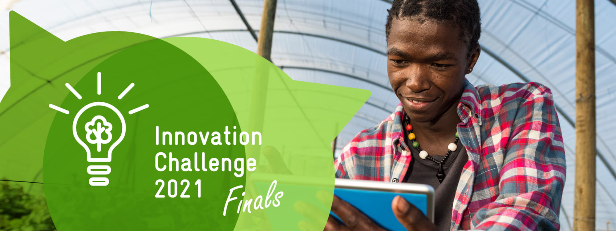 A young man in a plaid shirt uses a tablet under a greenhouse, with "Innovation Challenge 2021 Finals" displayed beside him.